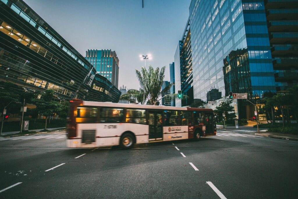 Milford bus accident lawyer features photo of bus in the middle of turning a new hamsphire intersection, by milford personal injury law firm